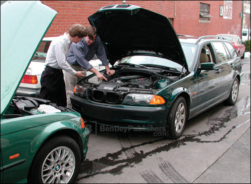 Bentley technical editors comparing features on E46 models